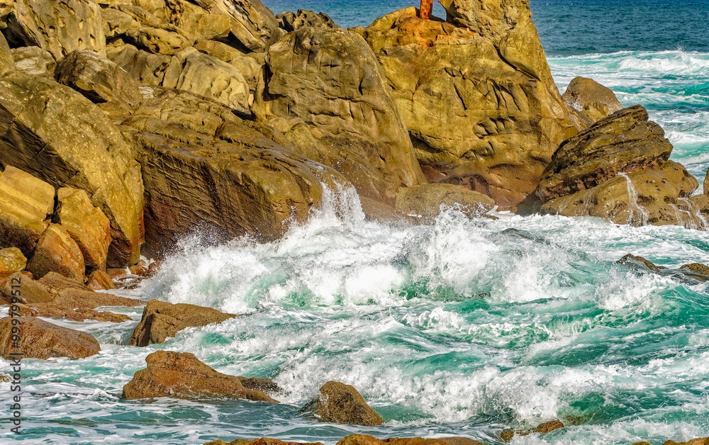 Fototapeta premium waves and rocks, beach and rocks, comb of the wind, San Sebastian - Donostia, Spain, September 2024