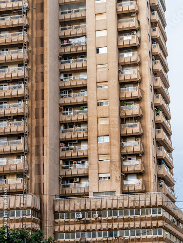 Brutalist and African modernist Fayçal building in Dakar, Senegal on a cloudy afternoon - Portrait Close-up photo