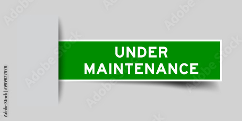 Green color square label sticker with word under maintenance that inserted in gray background