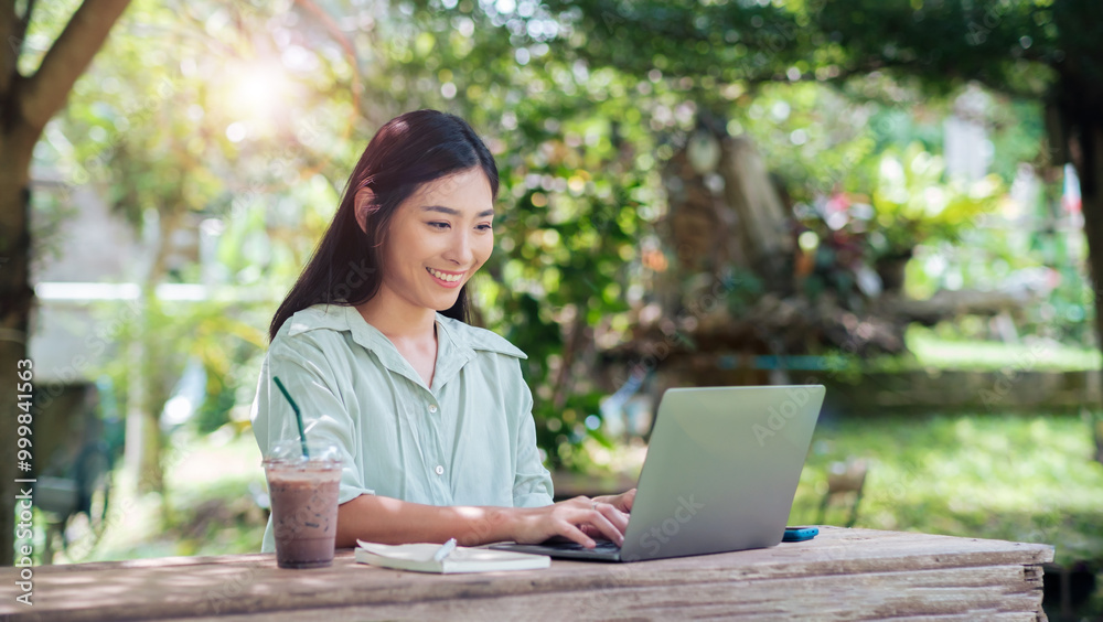 Asian business woman work outside enjoying fresh air working laptop computer portable device wireless remote digital technology, outdoor nature with drink, sitting park cafe under tree with sunlight Asian business woman work outside enjoying fresh air working laptop computer portable device wireless remote digital technology, outdoor nature with drink, sitting park cafe under tree with sunlight