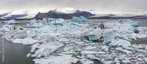 many iceberg drifting towards the ocean on a stormy day at Jökulsárlón Galcier Lagoon, Iceland