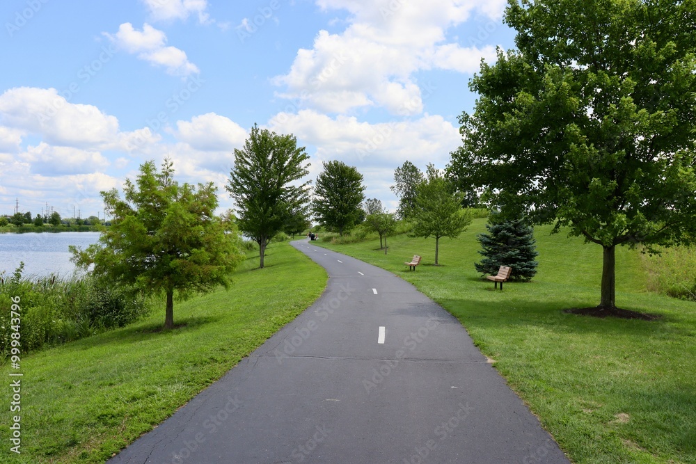 The empty pathway in the park on a sunny day. The empty pathway in the park on a sunny day.