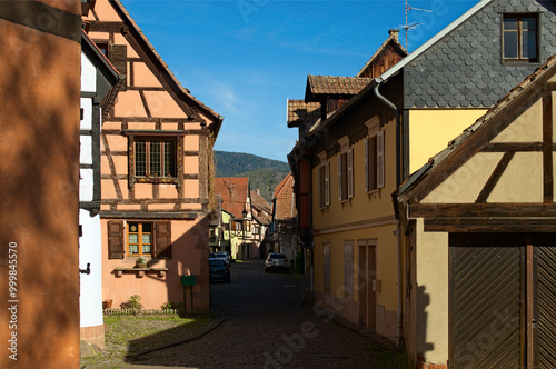 Scenic view of medieval street in in Riquewihr village, France. Typical architecture of Alsace region. Riquewihr village is a commune in the Haut-Rhin department in Grand Est in north-eastern France