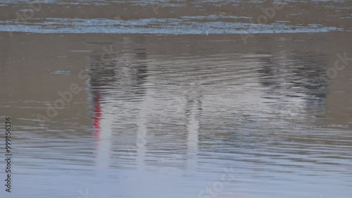 car silhouette falling into lake water,car silhouette reflected in water,