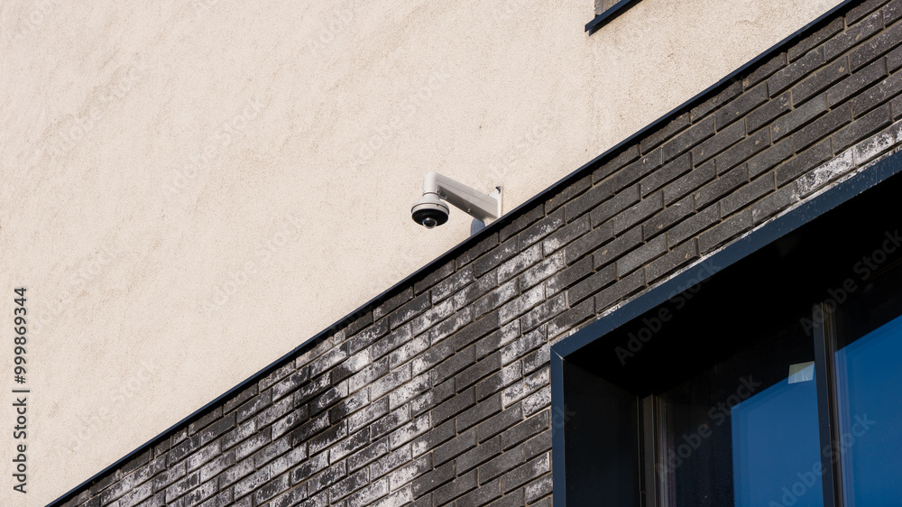A brick wall with a camera on it A brick wall with a camera on it