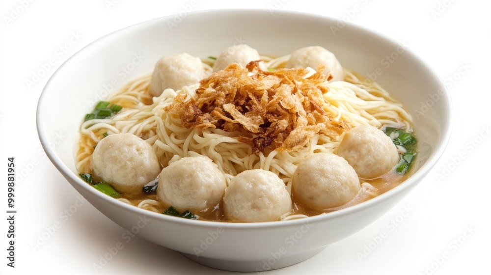A bowl of dry noodles with fish balls and crispy garlic, elegantly arranged against a white background, focusing on the textures and simplicity of the dish. A bowl of dry noodles with fish balls and crispy garlic, elegantly arranged against a white background, focusing on the textures and simplicity of the dish.