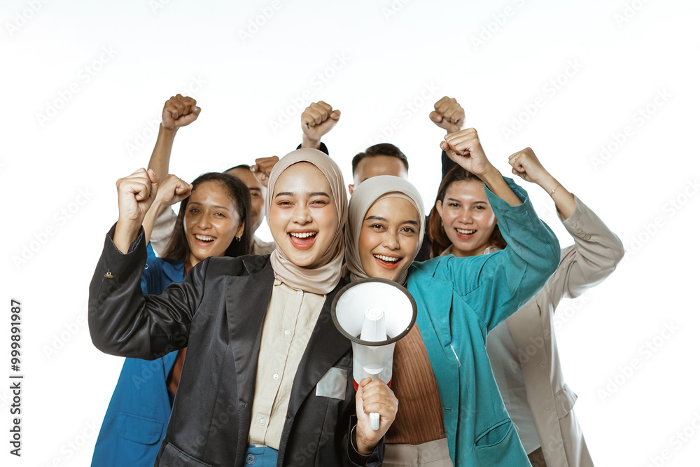 happy college student standing and raising fist hand in isolated white background happy college student standing and raising fist hand in isolated white background