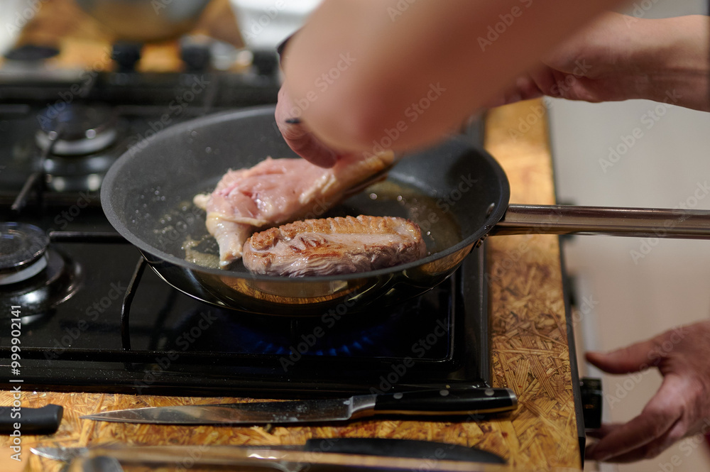 Chef's Searing Technique: Capturing the Culinary Art of Cooking Meat on a Stovetop in a Warm, Indoor Kitchen Environment