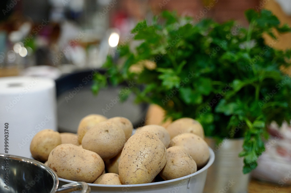 Fresh Potatoes and Parsley Set for Rustic Cooking in a Warm Kitchen, Amidst the Early Stages of Meal Preparation