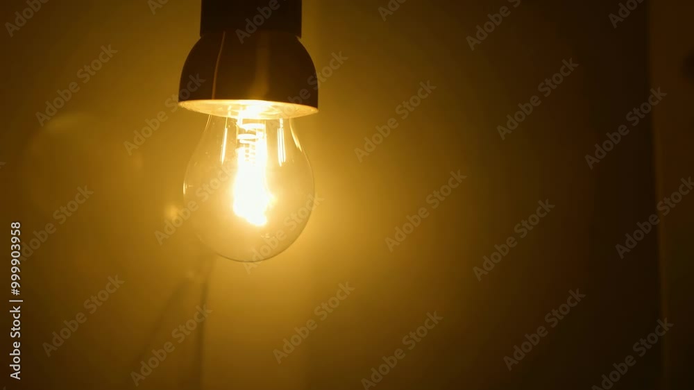 Glowing light bulb in warm ambience for cozy home decor inspiration Glowing light bulb in warm ambience for cozy home decor inspiration