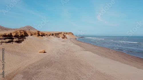 dunes in peru next to the beach 
