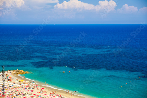 Fototapeta Naklejka Na Ścianę i Meble -  view from above on the beautiful sandy beach of bergeggi with the turquoise blue water of the mediterranean sea and sunshine