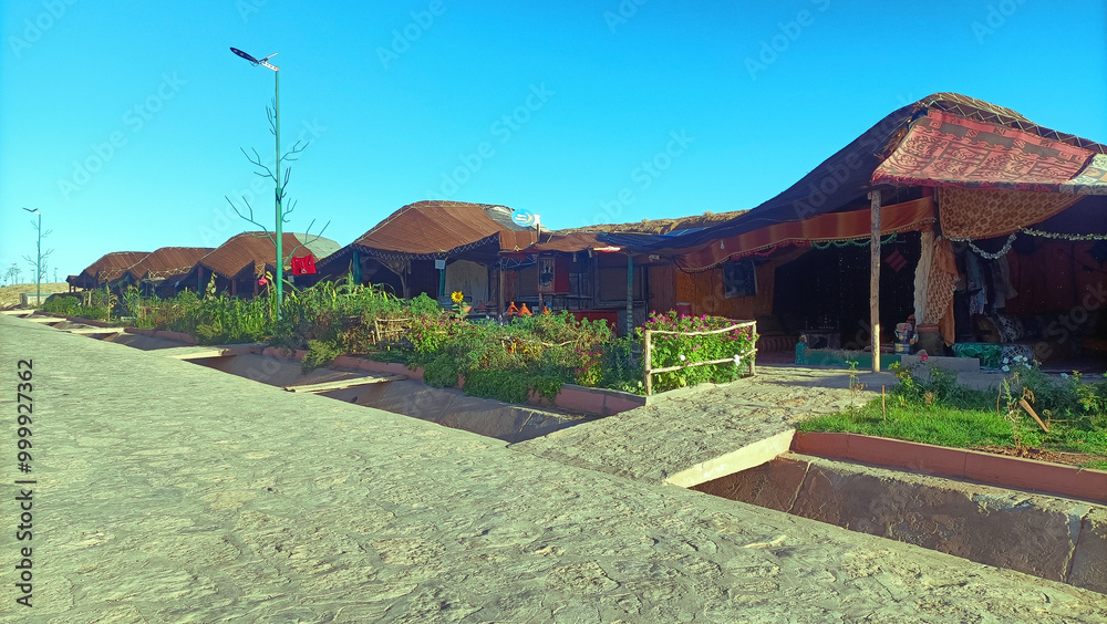 Obraz premium Row of traditional berber tents serving as a restaurant in Aguelmam Azegza, khenifra Morocco