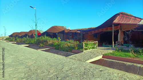 Row of traditional berber tents serving as a restaurant in Aguelmam Azegza, khenifra Morocco photo