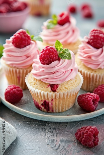 Delicious cup cake with raspberry fruit on table