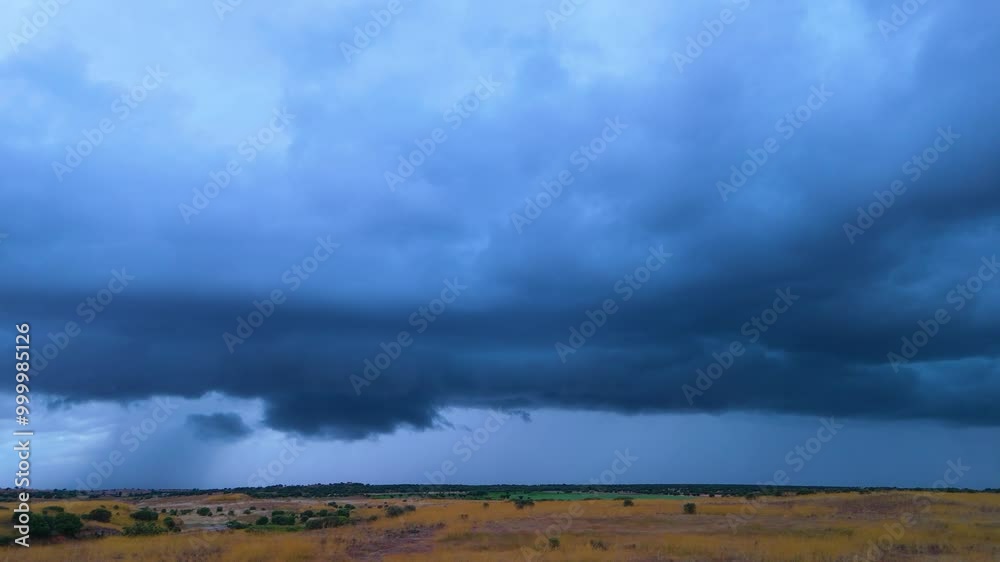 Aerial view from a drone of the storm with clouds and rain in spring in fields around the town of Tardobispo in the province of Zamora. Castilla y Leon. Spain. Europe Aerial view from a drone of the storm with clouds and rain in spring in fields around the town of Tardobispo in the province of Zamora. Castilla y Leon. Spain. Europe