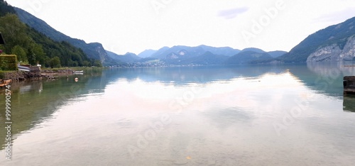 reflection of clouds in the surface of lake wolfgang in austria photo