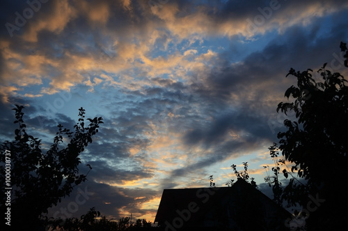 Natural background with clouds and sunlight in village in summer