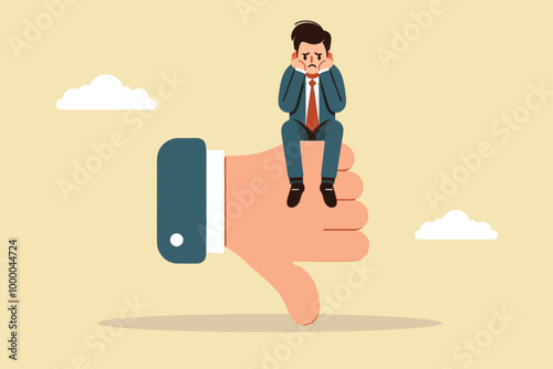 a sad businessman sits on his hands as a sign of displeasure