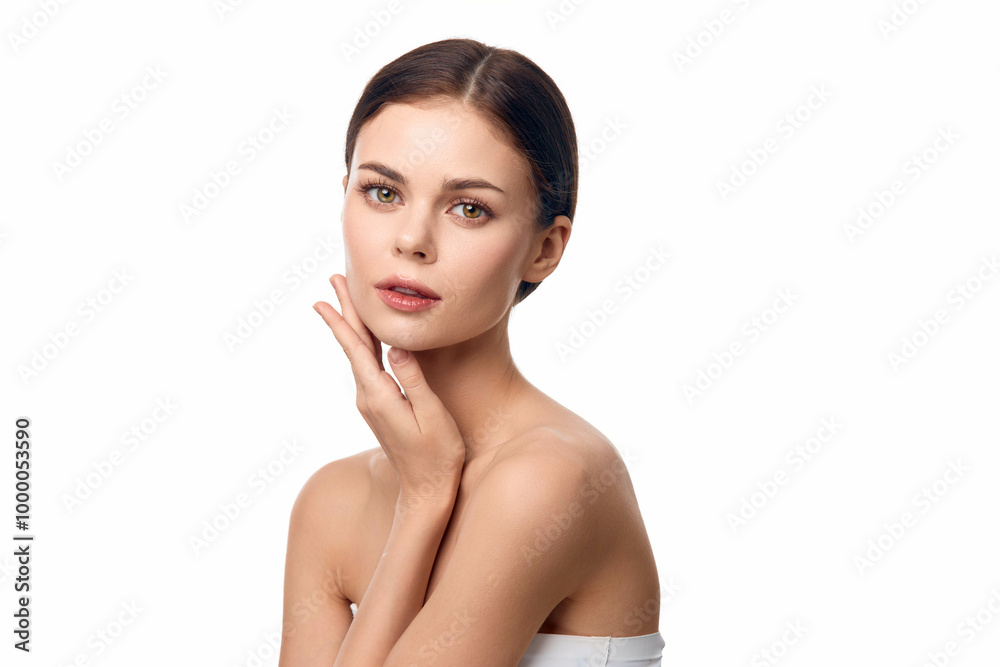 Beautiful young woman with hands on face posing on white background Beautiful young woman with hands on face posing on white background