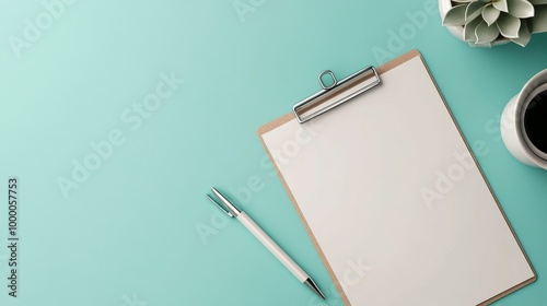 Blank clipboard and pen on blue background, ready for notes and organizationa...