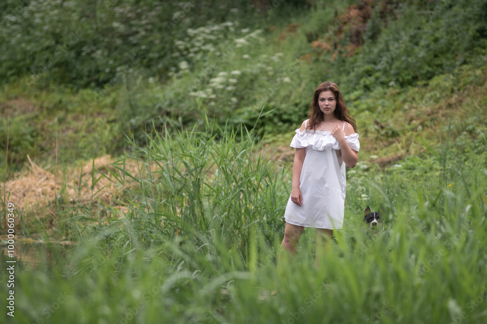 Beautiful young dark-haired girl by the river. Beautiful young dark-haired girl by the river.
