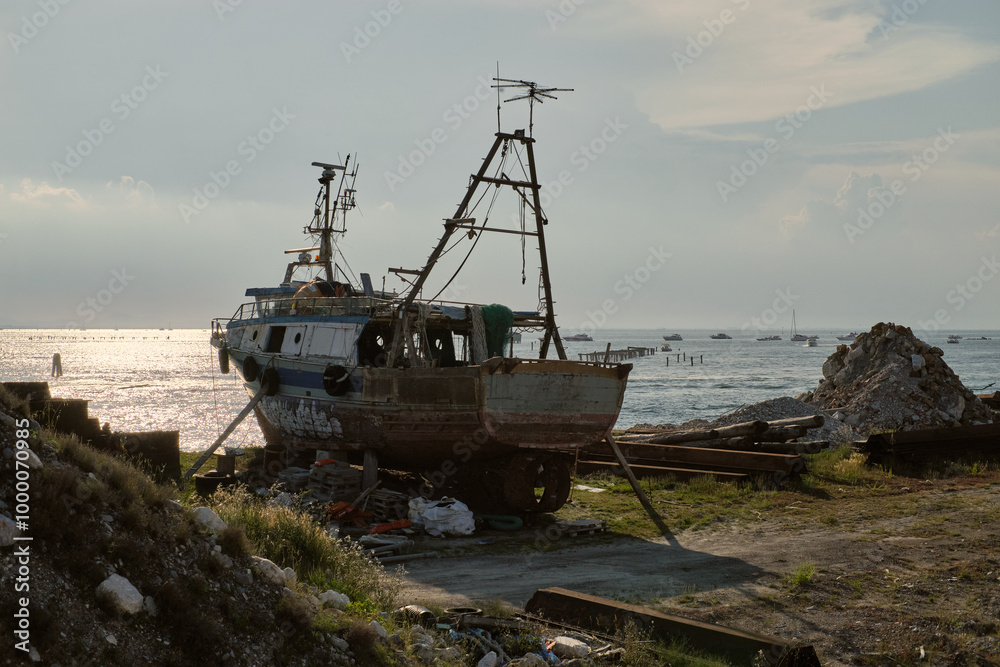 Old ship stranded on Pellestrina island , Venice, Italy Old ship stranded on Pellestrina island , Venice, Italy