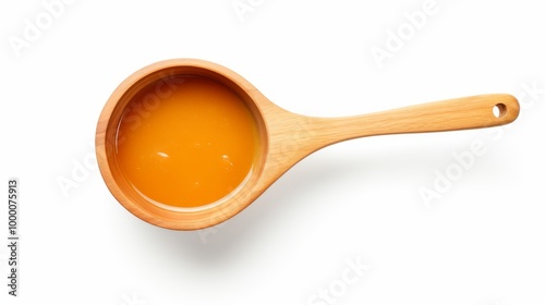 Wooden Spoon with Orange Liquid on White Background