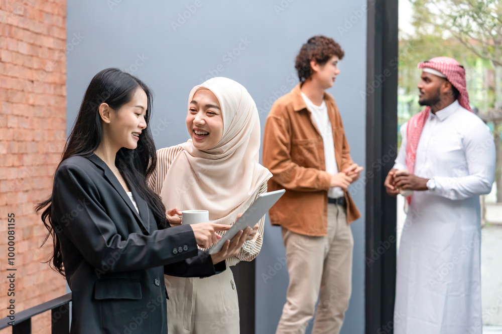 group of cheerful multi ethnic friends,students on a campus enjoy talking together during taking break group of cheerful multi ethnic friends,students on a campus enjoy talking together during taking break