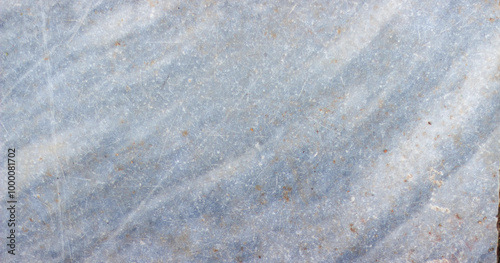 A textured close up of gray blue marble with subtle veins and natural stone pattern.