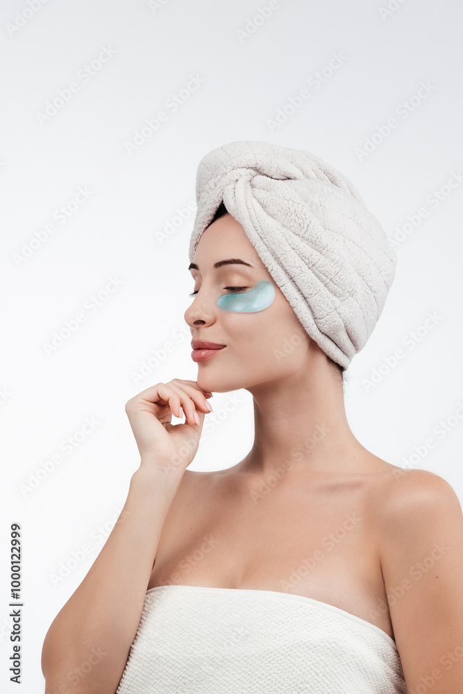 Close up of caucasian girl with natural no makeup, wears silicone under eye patches and smiling happy, using skincare products from dark circles, white background Close up of caucasian girl with natural no makeup, wears silicone under eye patches and smiling happy, using skincare products from dark circles, white background