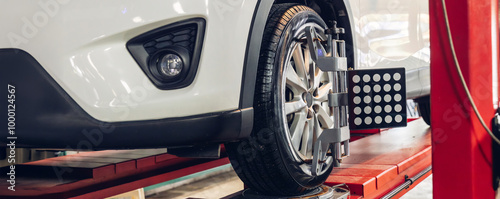 Wallpaper Mural Car wheel centering machine adjustment. Auto service mechanic installing wheel alignment sensor on tire during vehicle suspension alignment adjustment Torontodigital.ca