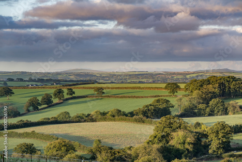 Rolling hills of Cornwall view towards Bodmin with gathering storm clouds photo