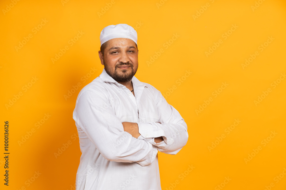 Portrait of Indian muslim on isolated background looking towards the camera Portrait of Indian muslim on isolated background looking towards the camera