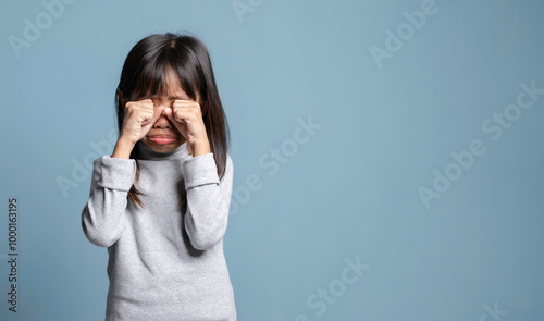 A little girl is stressed and crying, had a bad mood.