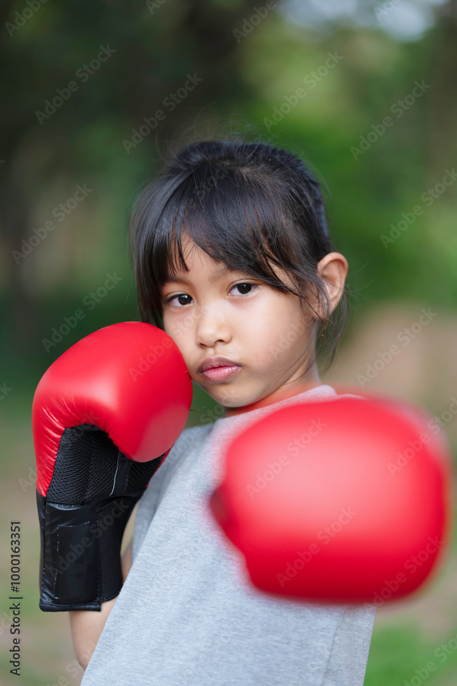 A little girl is exercising and boxing, Thai boxing A little girl is exercising and boxing, Thai boxing