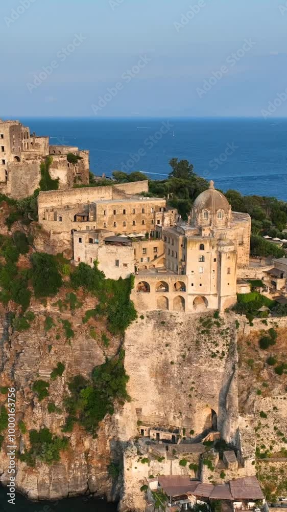 Ischia, Gulf of Naples, Italy, the island with the Aragonese castle.
Aerial view from drone, Vertical composition, of the islet of Ischia. Ischia, Gulf of Naples, Italy, the island with the Aragonese castle.
Aerial view from drone, Vertical composition, of the islet of Ischia.