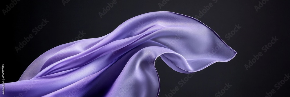 Abstract purple fabric swirling and flowing on a black background. Representing elegance, movement, luxury, fluidity, and grace. Abstract purple fabric swirling and flowing on a black background. Representing elegance, movement, luxury, fluidity, and grace.