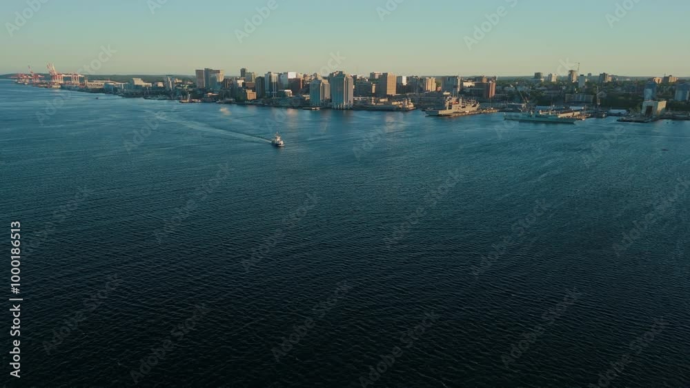 A Stunning Aerial View Of Dartmouth Downtown And The Bay At Sunset, With The Skyscrapers Of Halifax Glowing In The Distance On A Beautiful Summer Evening In Nova Scotia. A Stunning Aerial View Of Dartmouth Downtown And The Bay At Sunset, With The Skyscrapers Of Halifax Glowing In The Distance On A Beautiful Summer Evening In Nova Scotia.
