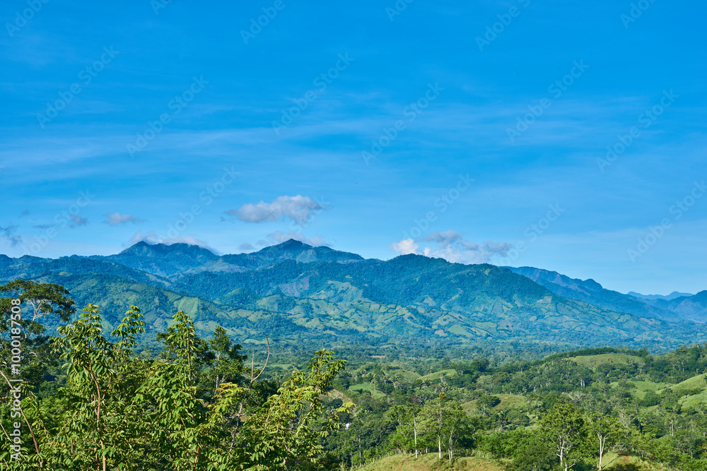 green mountain range with blue sky and clouds, abundant nature green mountain range with blue sky and clouds, abundant nature