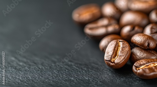 A detailed look at stacked roasted coffee beans lying on a smooth surface, highlighting the individual beans' grooves and rich textures ideal for food and beverage themes.