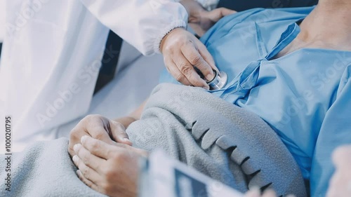 A doctor examining a middle-aged male patient in a coma in a hospital bed