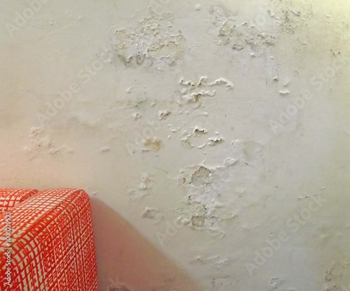 Plaster wall damaged by rising damp photo