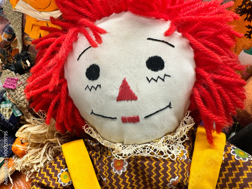 Close up of a homemade Raggety Ann doll, dressed for fall or Halloween photo