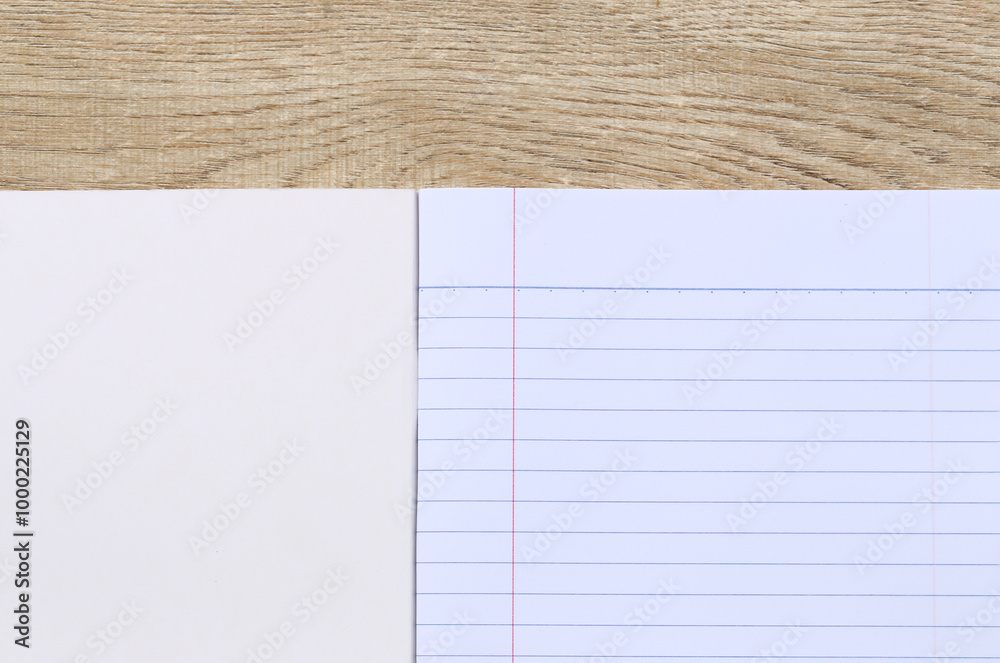 Naklejka premium Blank Notebook on Wooden Table for Creativity