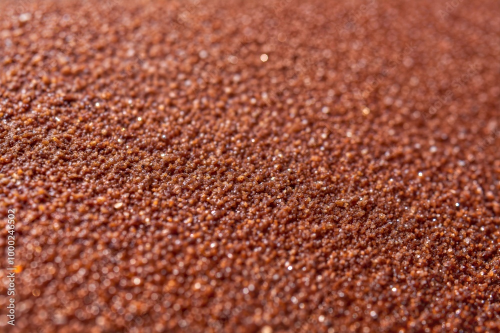 Close-up of brown granular surface with rough texture Close-up of brown granular surface with rough texture