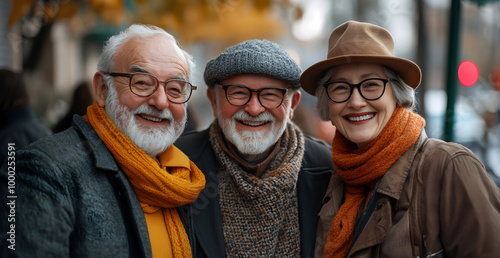 Three older people are smiling and posing for a photo