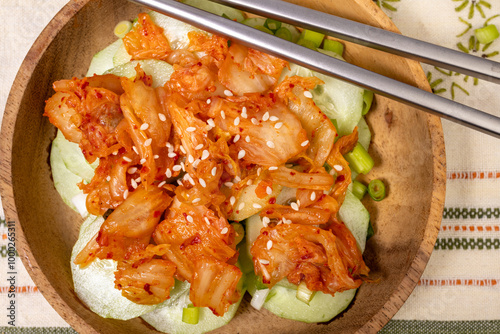 Wooden bowl with a Kimchi and Cucumber salad