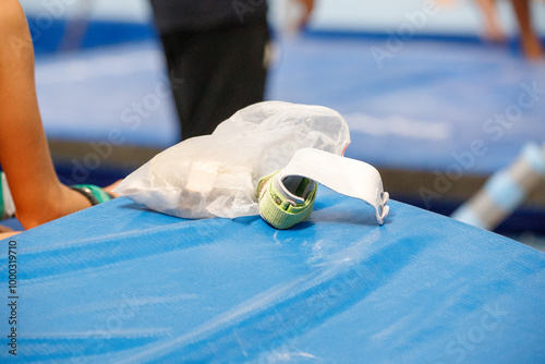 gymnastics hand grip on top of a blue mat during an artistic gymnastics training session in Rio de Janeiro. photo