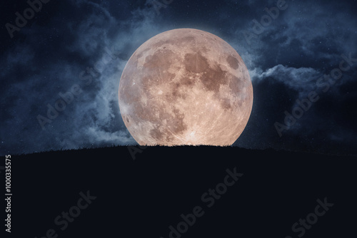 Fototapeta Naklejka Na Ścianę i Meble -  Big amazing full moon with grass and starry sky with clouds. Halloween creative